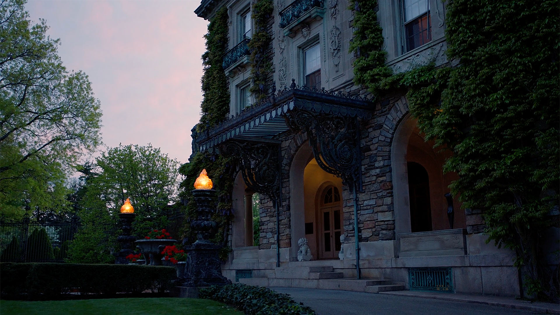 The Kykuit Rockefeller home entrance lit up at dusk