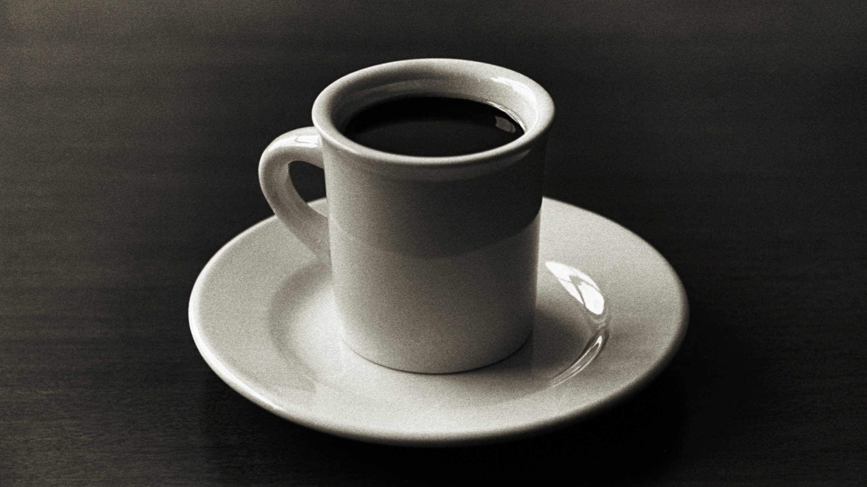 Classic coffee cup in dark sepia tone color